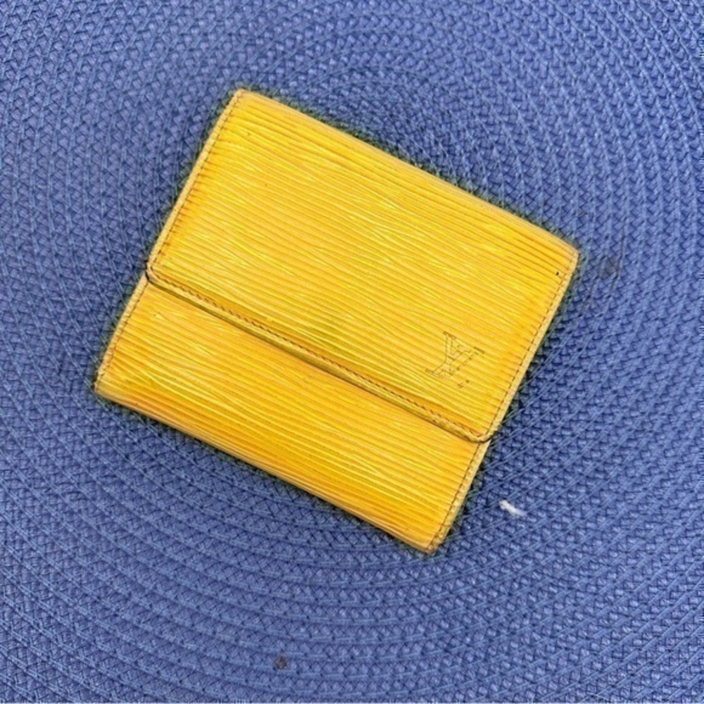 AUTHENTIC Louis Vuitton Marco Wallet. Previously owned. Tassel yellow.